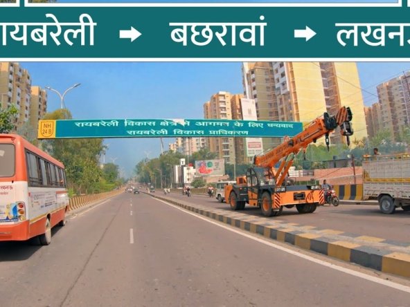 Best-Residential-Area-in-Lucknow-raebareli-highway-with-signage-broad-bus-and-crane